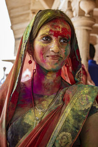 Portrait of woman with multi colored face