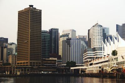 Skyscrapers in city against clear sky