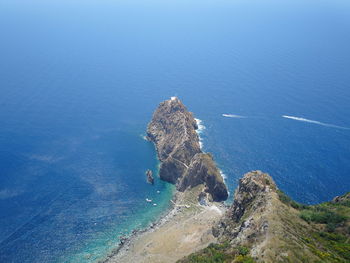High angle view of rock on sea shore