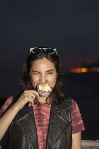 Young woman enjoying a candy apple