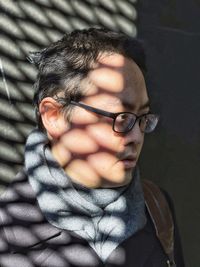 Close-up portrait of man wearing eyeglasses