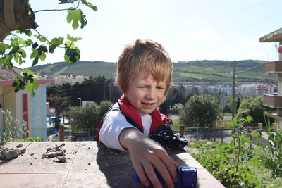 Portrait of young woman using mobile phone