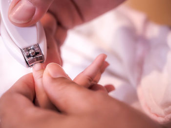 Close-up of woman holding hands