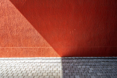 Low section of man standing on footpath