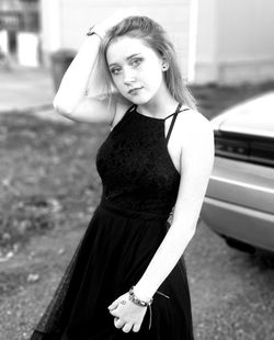 Portrait of teenage girl standing outdoors