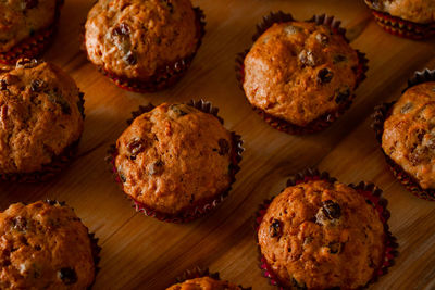 Homemade raisin cupcakes. traditional autumn pastries on a wooden background.