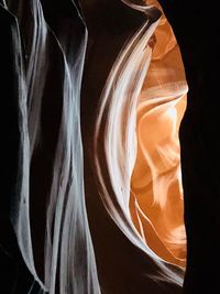 Close-up of rock formation against black background