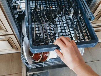 Open the dishwasher with clean dishes. the trend of cleaning and cleanliness.