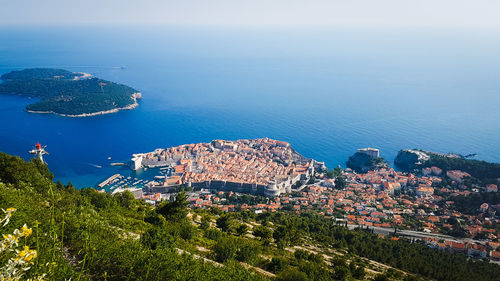 High angle view of townscape by sea