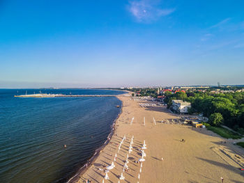 High angle view of beach against blue sky, aerial view on the pier and in sopot, poland,