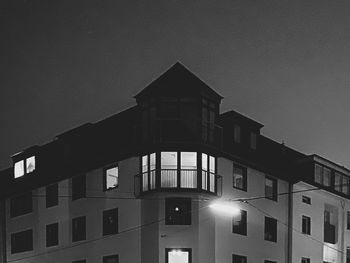 Low angle view of building against sky at dusk