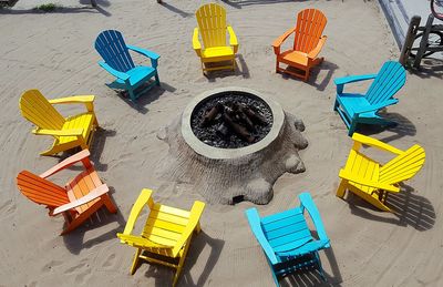 High angle view of yellow deck chairs