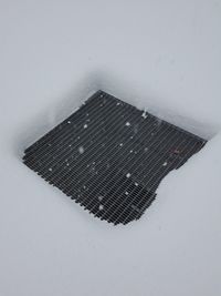 High angle view of snow covered wet window