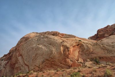 Rock formations in desert against sky