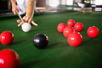 Midsection of man with ball on table
