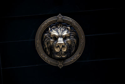 Close up of carvings on black background