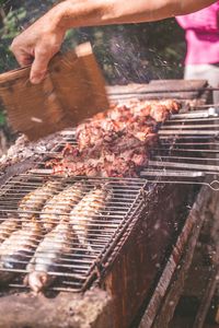 High angle view of meat on barbecue grill