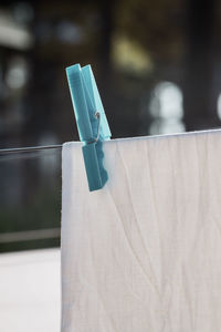 Clothspin fixes laundry hanging on the line to dry