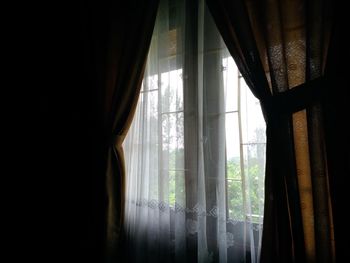 Close-up of curtain in window at home