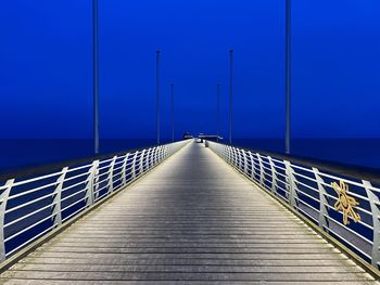 Pier over sea against sky