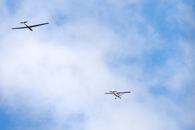 Low angle view of airplane flying in sky