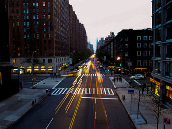 Illuminated city street at night