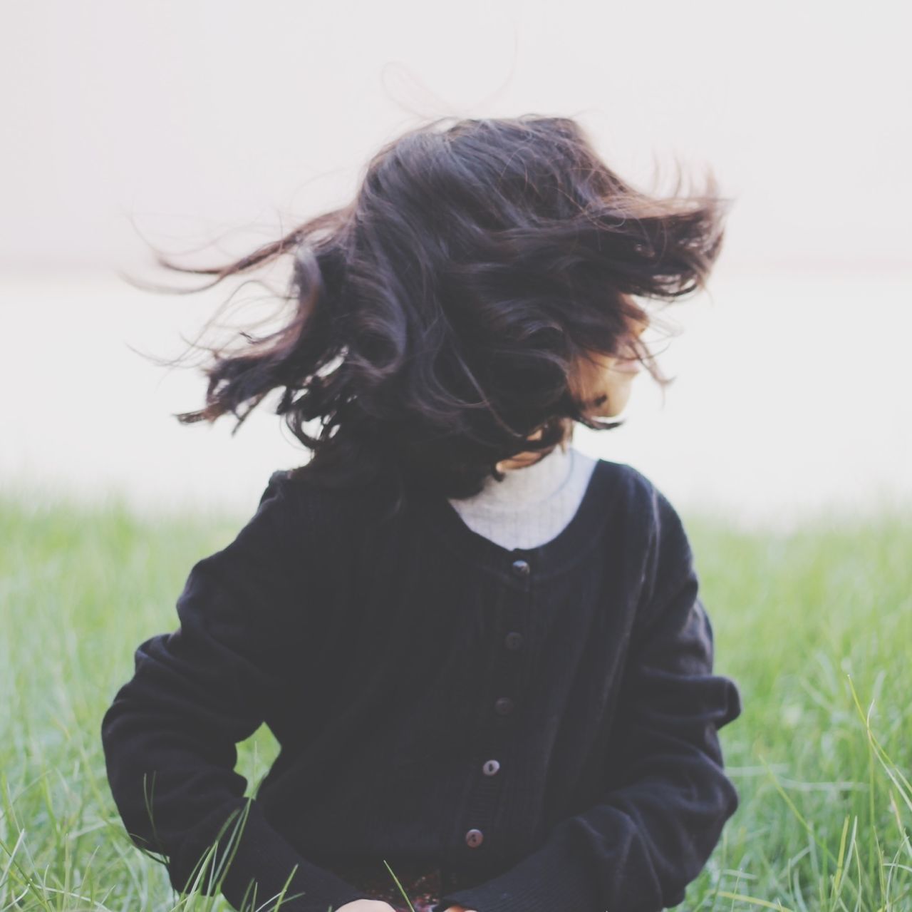 long hair, lifestyles, leisure activity, waist up, casual clothing, young women, young adult, field, headshot, focus on foreground, grass, rear view, three quarter length, person, standing, brown hair, blond hair