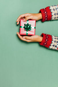 Close-up of hand holding christmas decoration