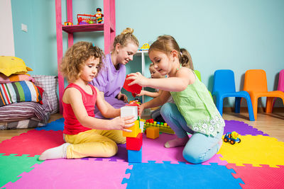 Teacher playing with students