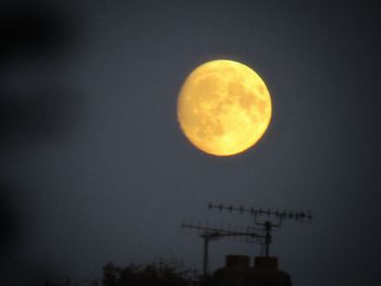 Low angle view of moon against sky at night