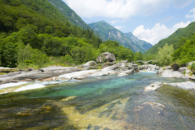 Scenic view of river against mountains