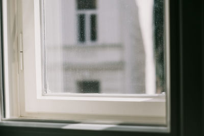 Close-up of glass window of building