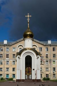 Low angle view of church against building