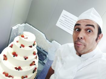 Close-up portrait of man with ice cream