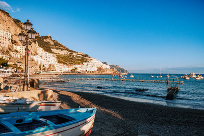 Scenic view of sea against clear blue sky