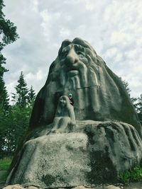 Low angle view of statue against sky