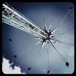 Low angle view of ferris wheel against sky