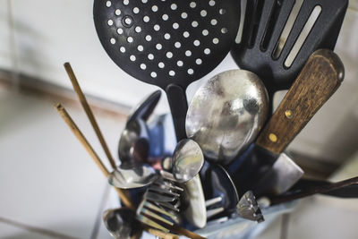 High angle view of various utensils in container at kitchen