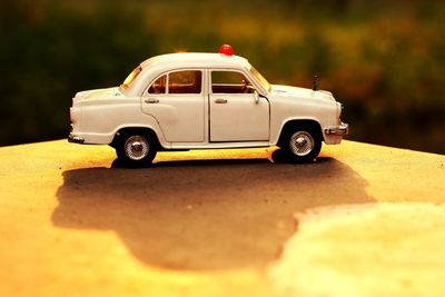 Close-up of toy car on road