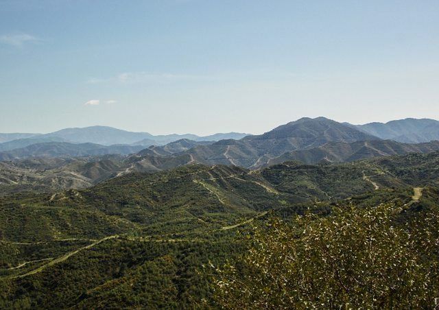 mountain, mountain range, tranquil scene, tranquility, scenics, landscape, beauty in nature, nature, clear sky, sky, non-urban scene, idyllic, remote, copy space, outdoors, day, no people, hill, high angle view, blue