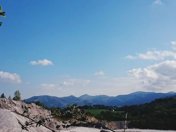 Countryside landscape against blue sky