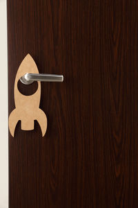 Close-up of rocket sign on doorknob