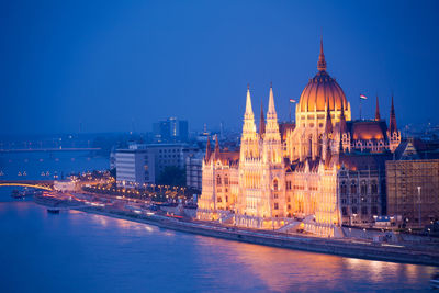 Illuminated buildings at waterfront