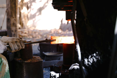 People working on barbecue grill