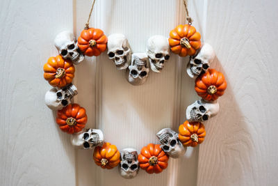 Close-up of orange fruits hanging on door