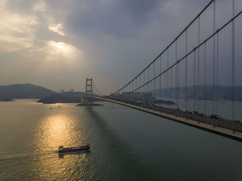 View of suspension bridge over sea