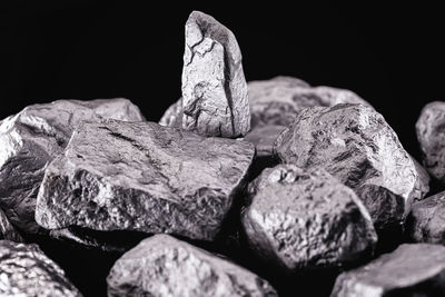 Close-up of rocks against black background