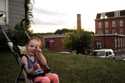 Full length of woman sitting on bicycle