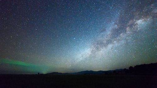 Scenic view of star field against sky at night