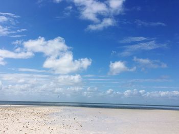 Scenic view of sea against blue sky